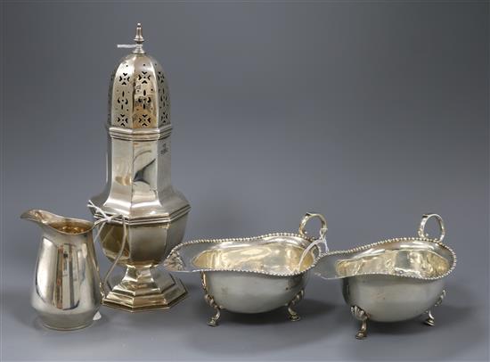 A silver octagonal baluster sugar caster, a pair of sauce boats with gadrooned edges and a cream jug, total weight approx 18oz